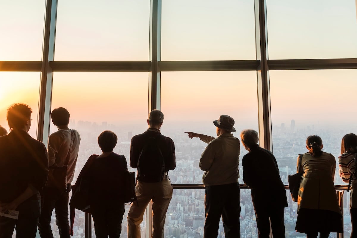 rear-view-silhouette-of-a-group-of-people-looking-2025-04-03-21-16-56-utc